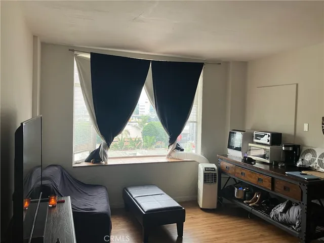 a view of workspace with furniture and window