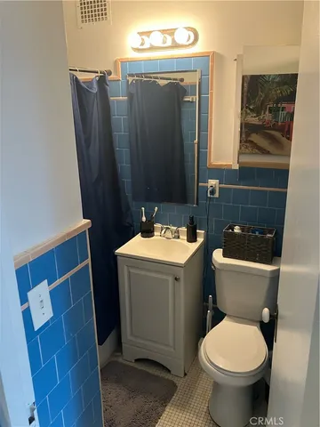 a bathroom with a toilet and a sink