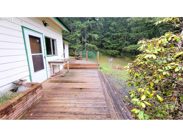 a balcony with table and chairs