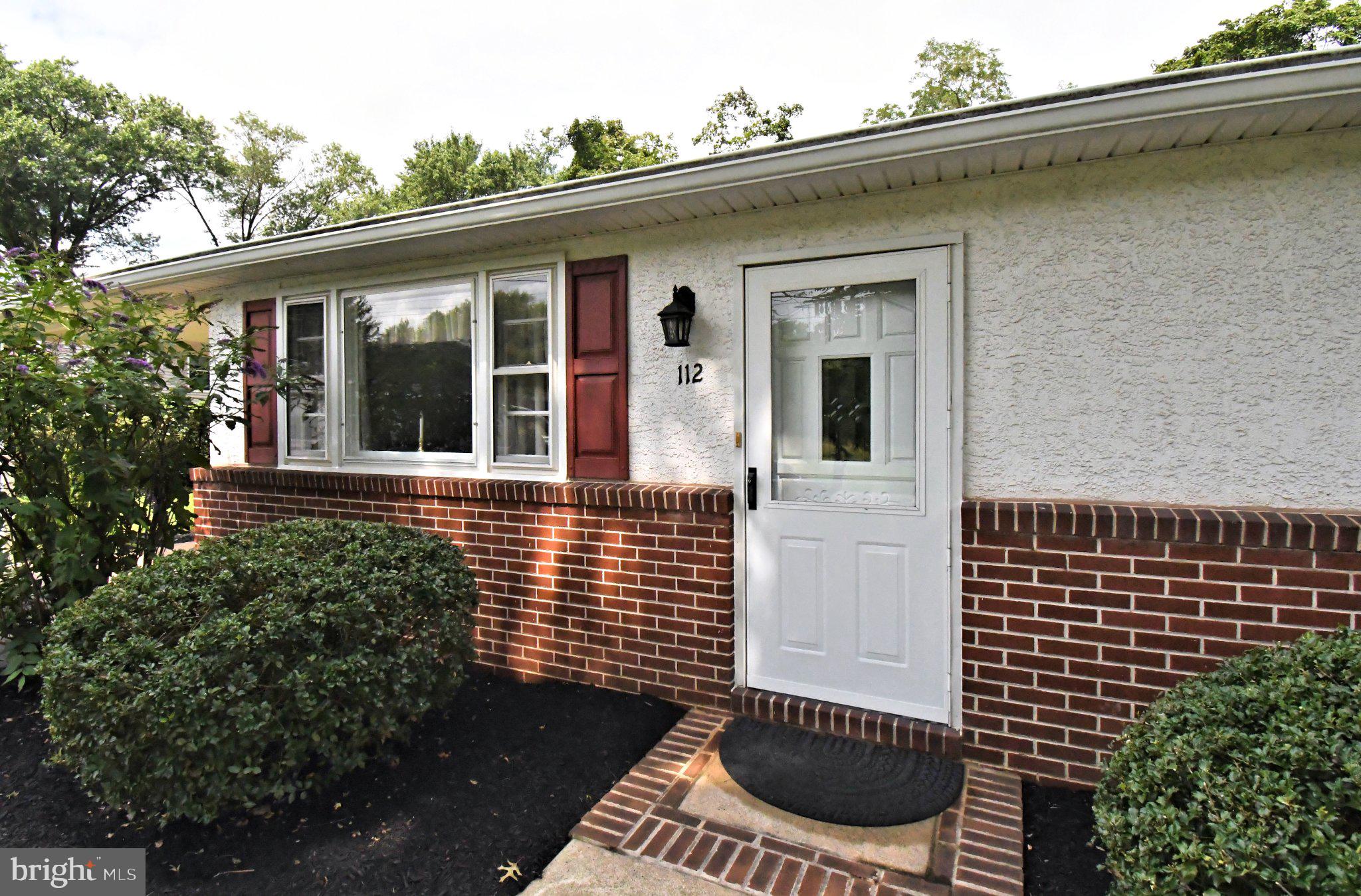 112 Pennapacker Road Collegeville, PA 19426 - Photo 3 of 43 Charming entryway with lush greenery.
