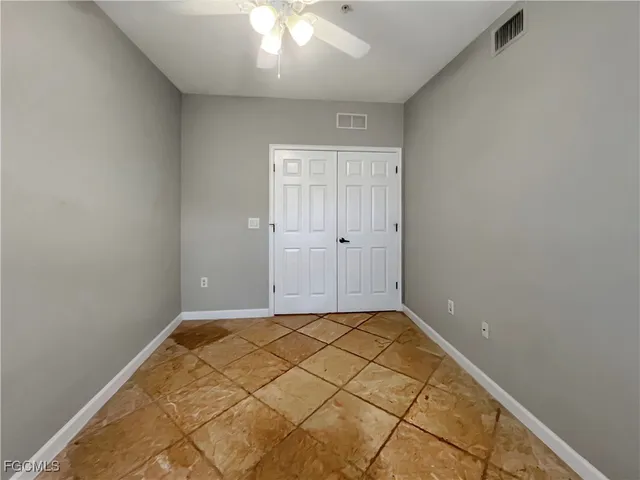 an empty room with windows