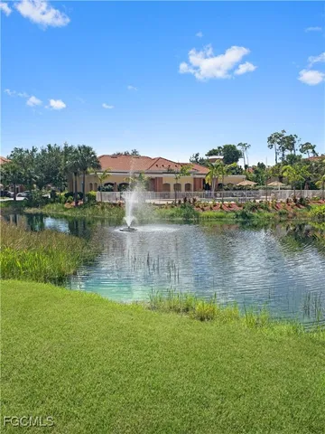 a view of a lake with a big yard