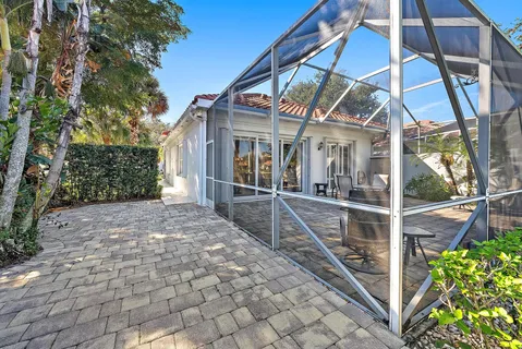 a view of a chairs and table in the balcony