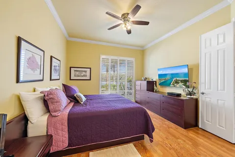 a bedroom with a large bed and a window