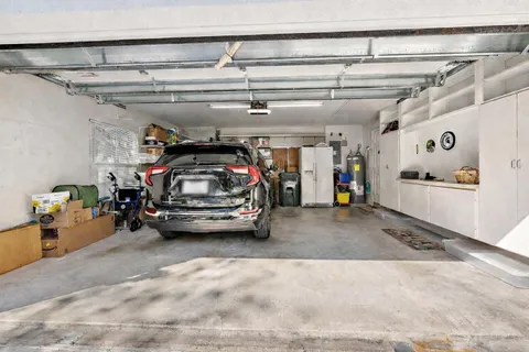 a view of parking garage with cars