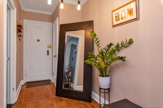 a view of entryway with wooden floor