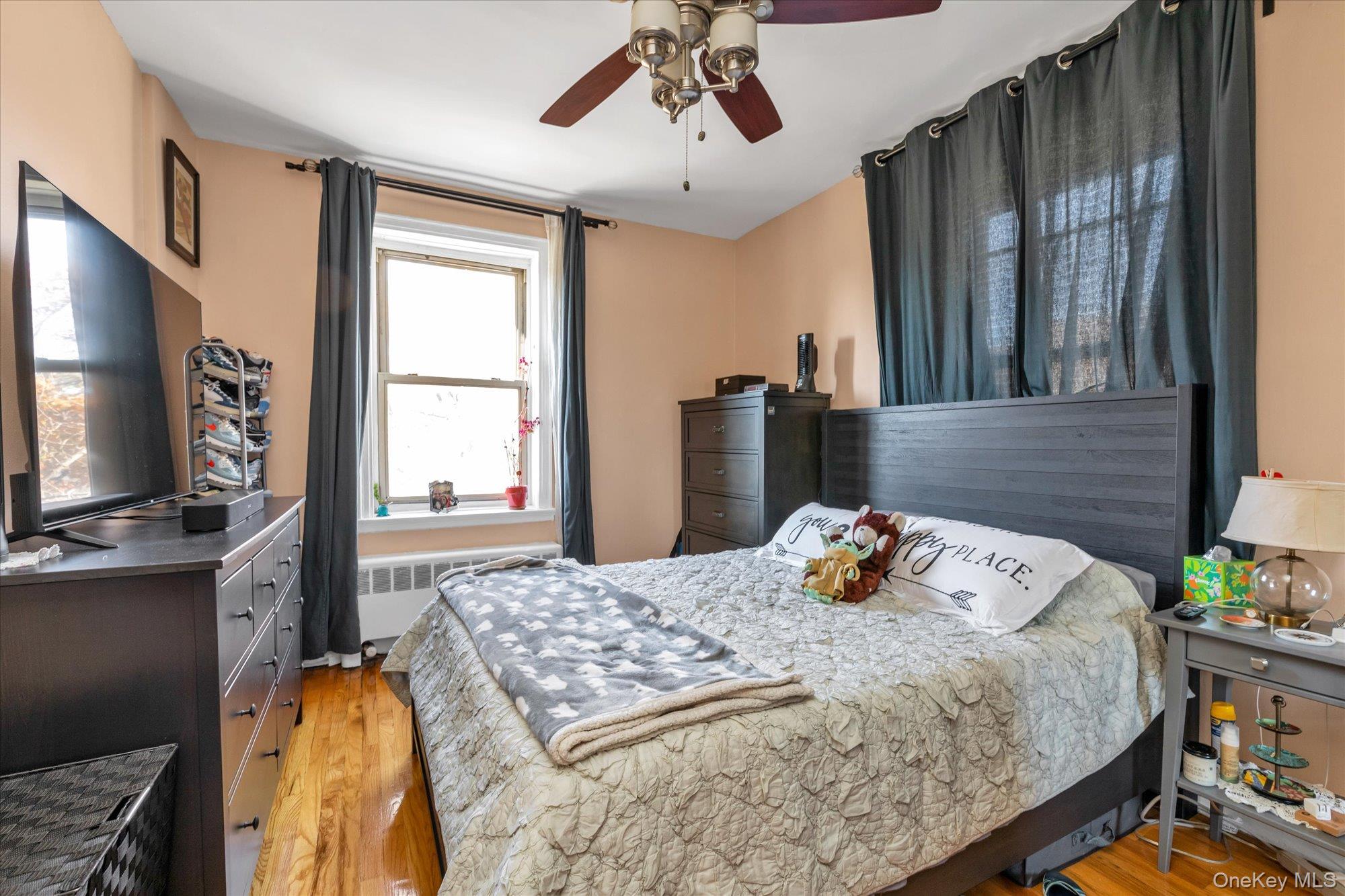 48-55 43rd Street, Unit 3F Queens, NY 11377 - Photo 8 of 12 a bedroom with a bed and large windows