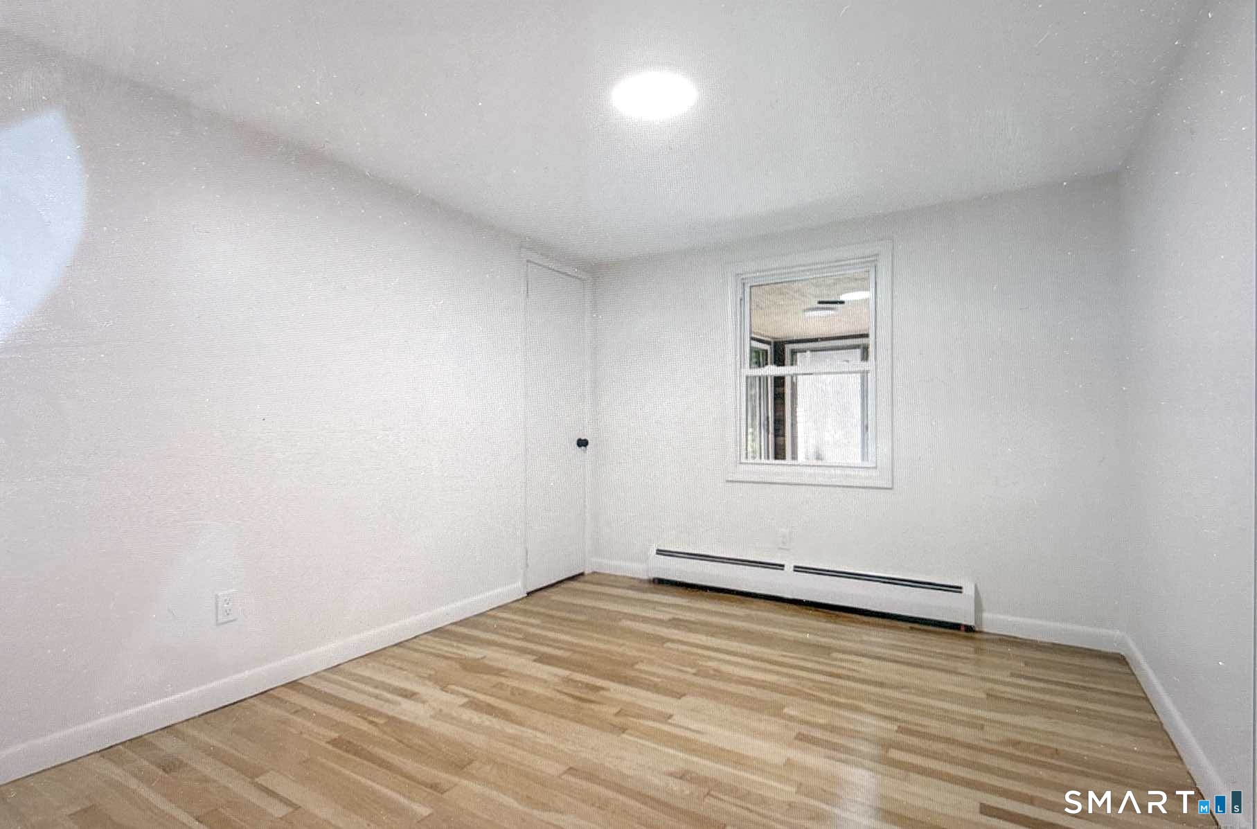 303 Bunker Hill Avenue Waterbury, CT 06708 - Photo 4 of 5 wooden floor in an empty room