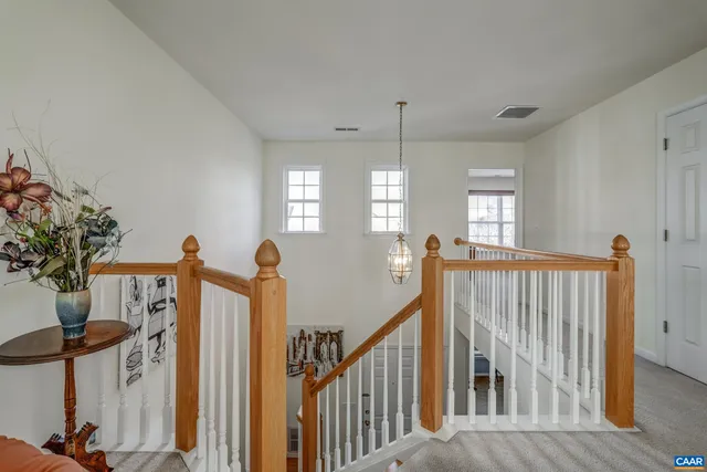 a view of a hallway with windows