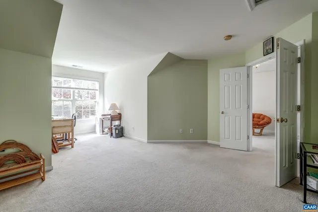 a view of a livingroom with furniture and a window