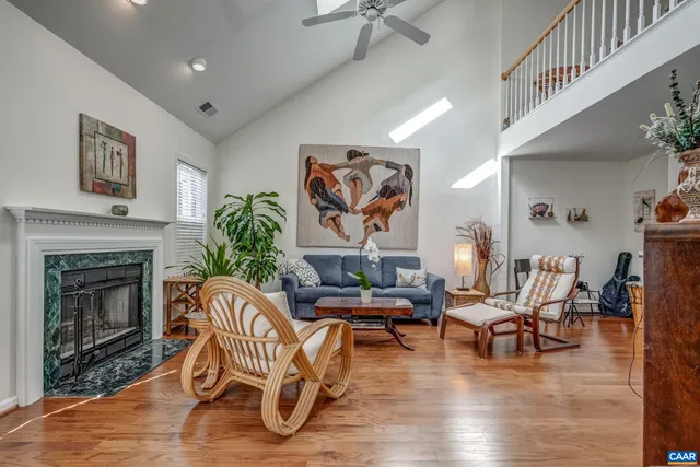 a living room with furniture and a fireplace