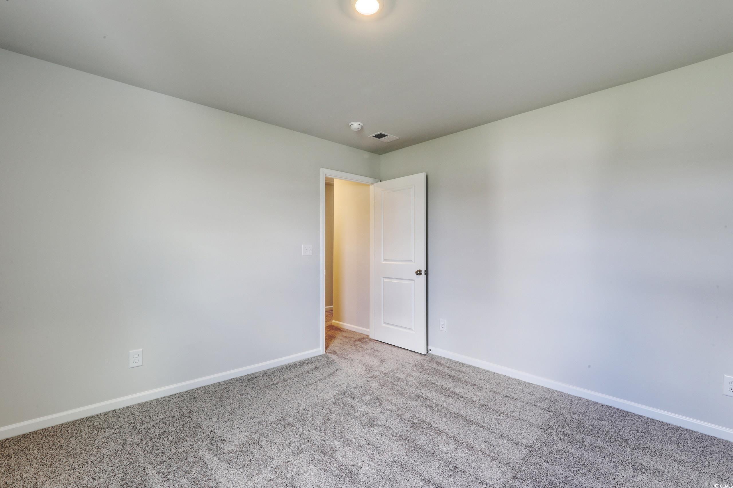 728 St Albans Loop Conway, SC 29526 - Photo 13 of 19 Spare room with light carpet