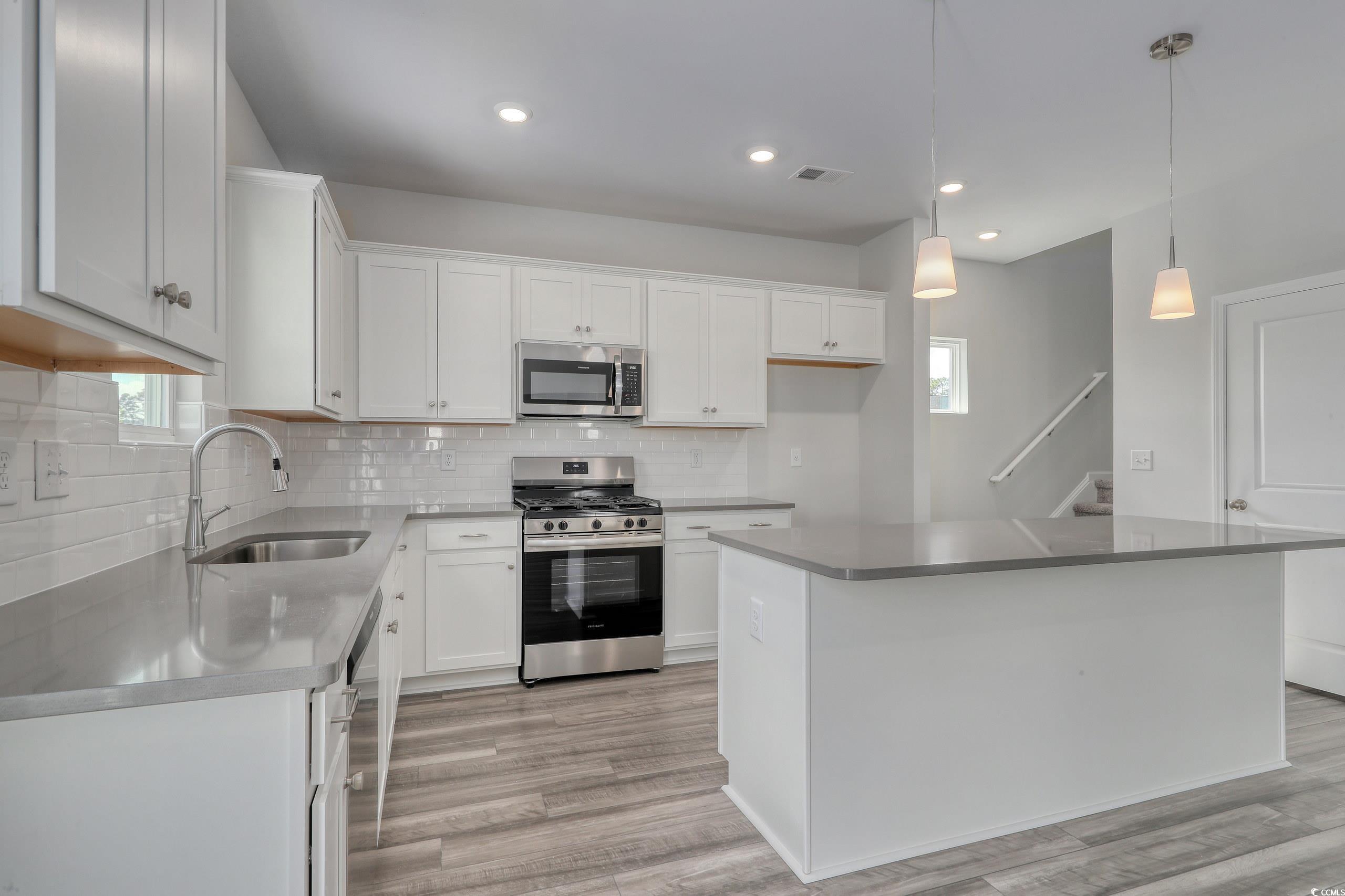 728 St Albans Loop Conway, SC 29526 - Photo 5 of 19 Kitchen featuring hanging light fixtures, sink, a