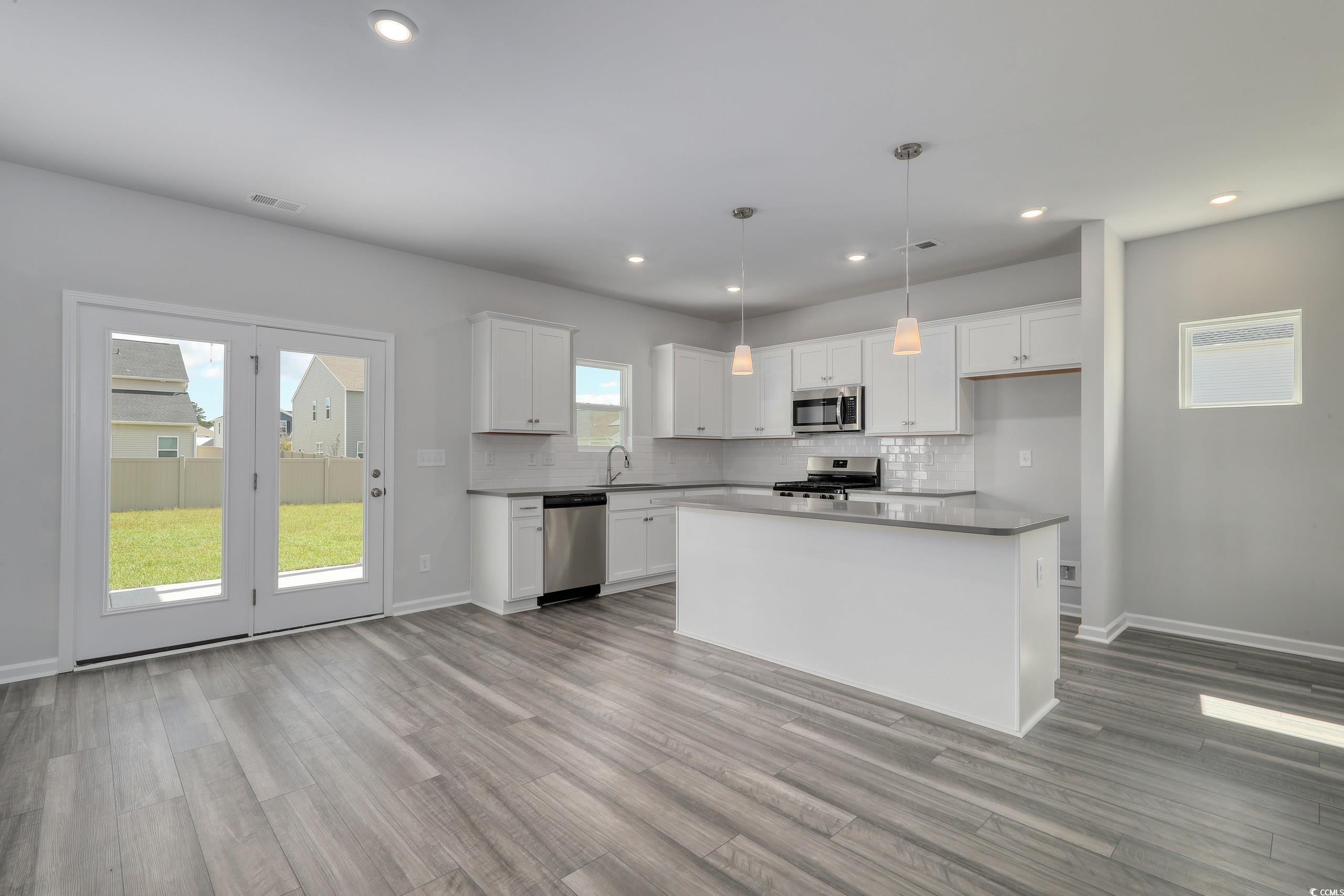 728 St Albans Loop Conway, SC 29526 - Photo 7 of 19 Kitchen featuring light wood-type flooring, a kitc