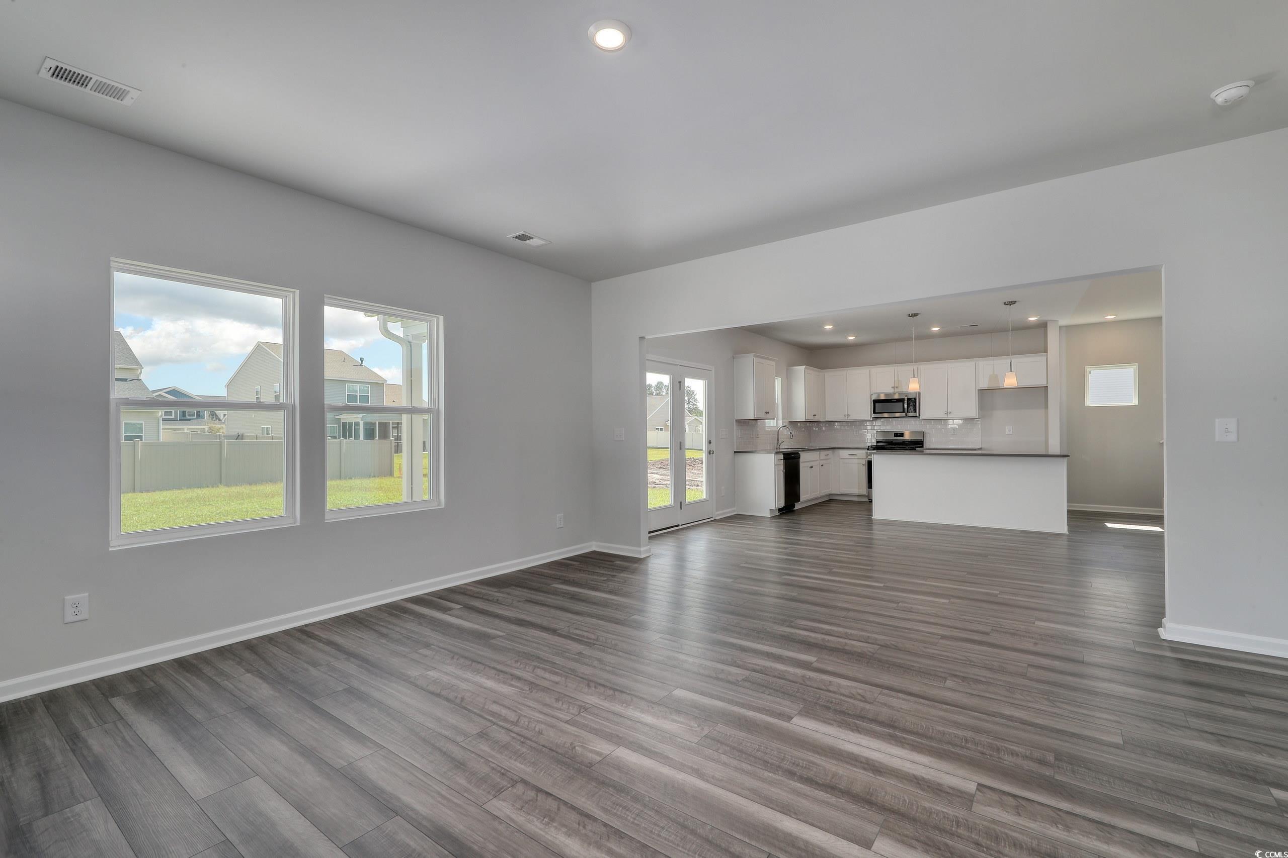 728 St Albans Loop Conway, SC 29526 - Photo 9 of 19 Unfurnished living room with dark hardwood / wood-