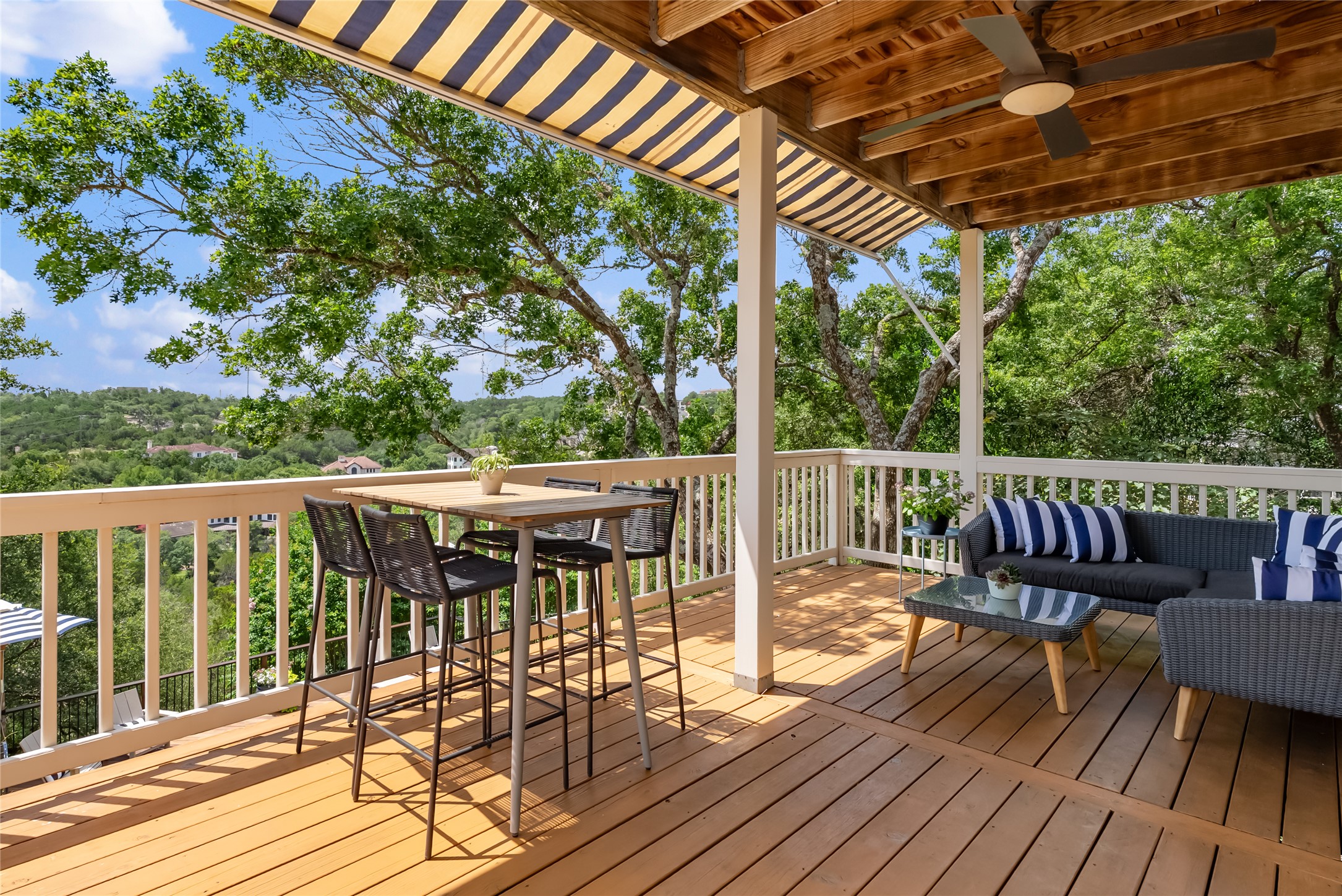 3107 Lookout Lane Austin, TX 78746 - Photo 15 of 39 A spacious outdoor deck with a beautiful treed view provides an ideal setting for relaxation.