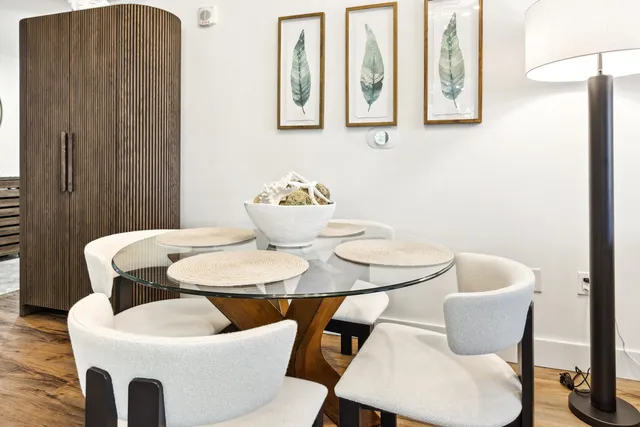 a view of a dining room with furniture and wooden floor