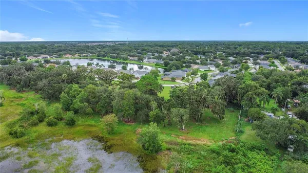 a view of a lake with a yard