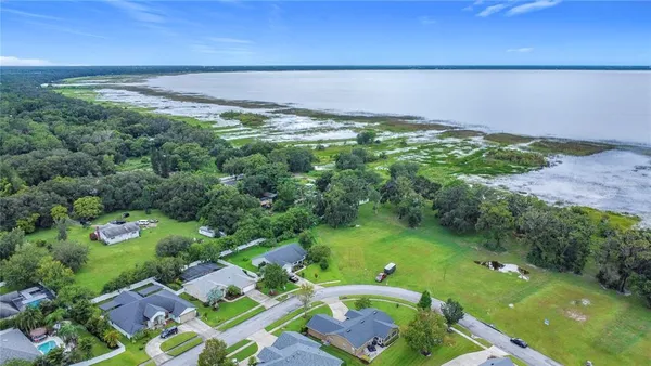 a view of a lake with a yard