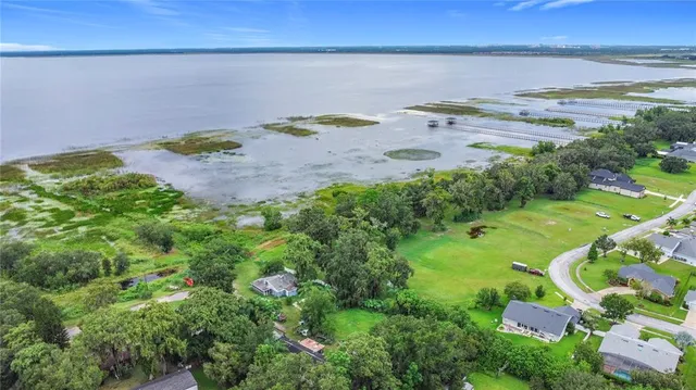 a view of a swimming pool with a yard