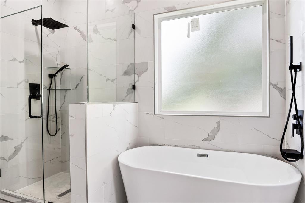 3102 Chicago Street Dallas, TX 75212 - Photo 12 of 20 a white bath tub sitting next to a shower