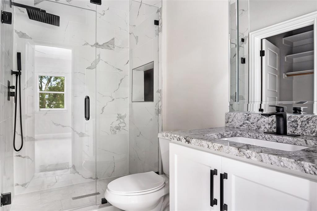 3102 Chicago Street Dallas, TX 75212 - Photo 15 of 20 a bathroom with a granite countertop sink a toilet and shower