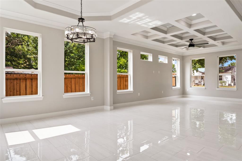 3102 Chicago Street Dallas, TX 75212 - Photo 2 of 20 a view of an empty room with window and chandelier
