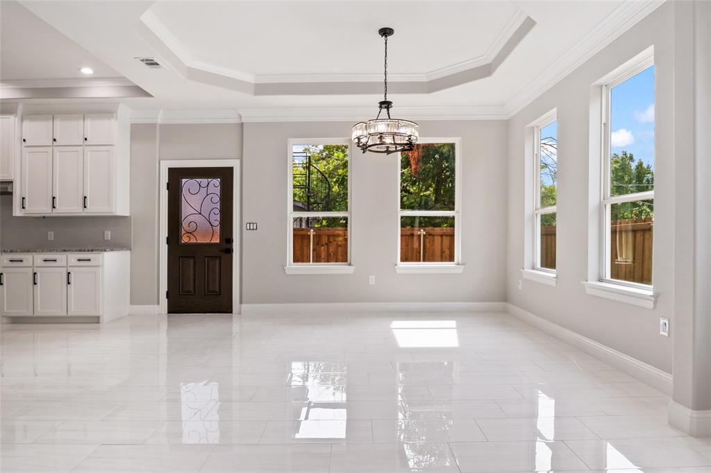 3102 Chicago Street Dallas, TX 75212 - Photo 4 of 20 a view of an empty room with window and cabinet