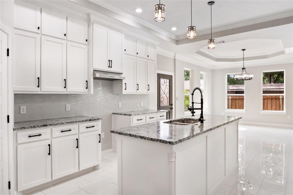 3102 Chicago Street Dallas, TX 75212 - Photo 6 of 20 a kitchen with white cabinets and sink