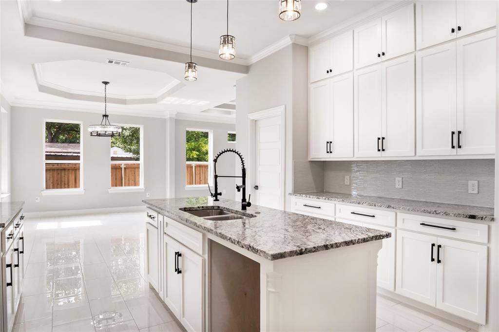 3102 Chicago Street Dallas, TX 75212 - Photo 7 of 20 a kitchen with granite countertop a sink and cabinets
