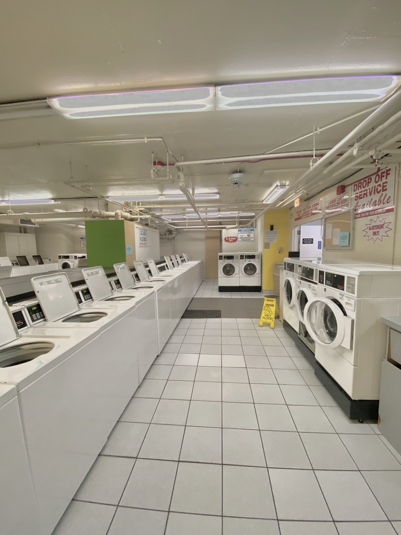 655 West Irving Park Road, Unit 2112 Chicago, IL 60613 - Photo 39 of 49 a storage room with washer and dryer