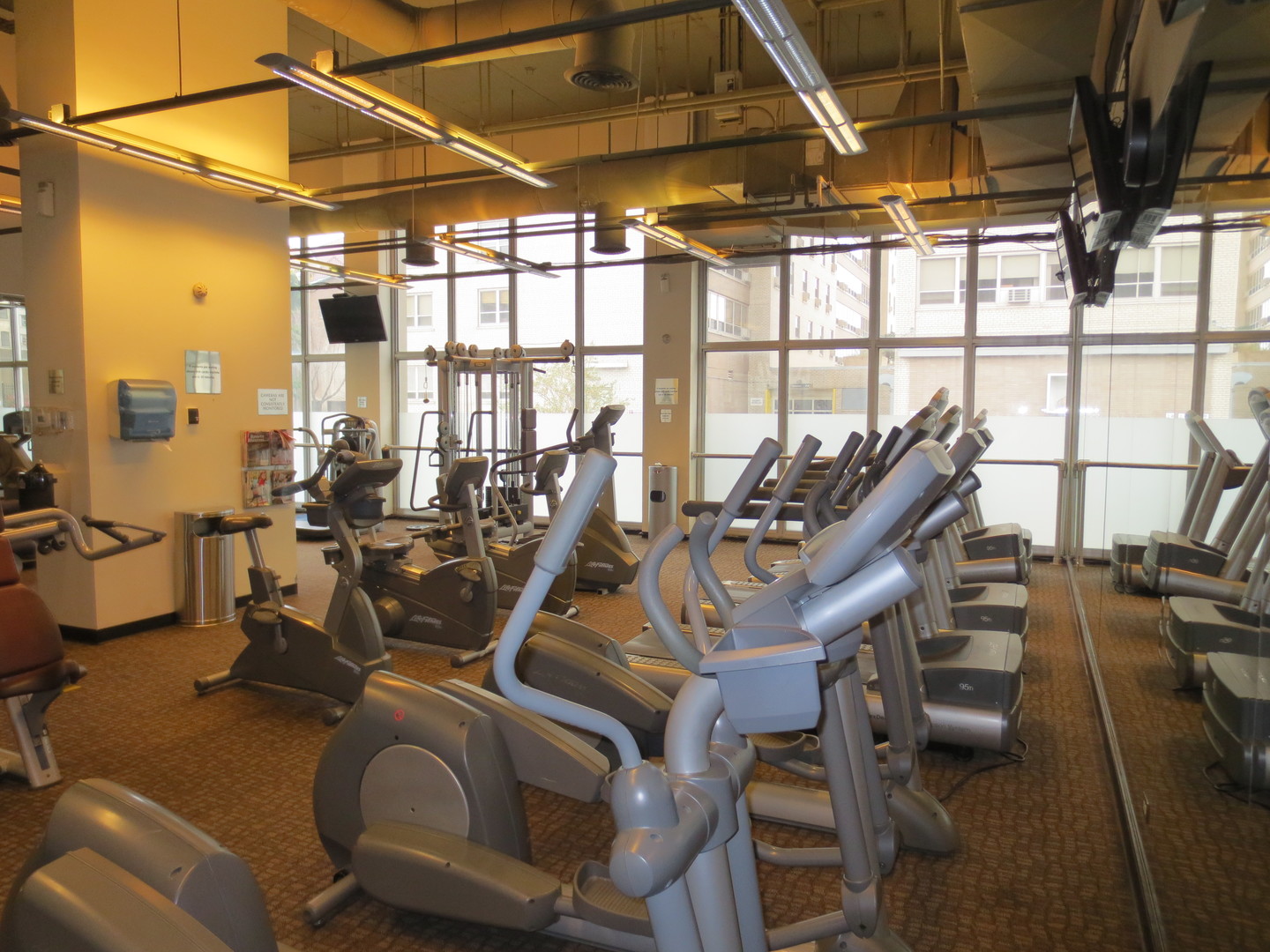 655 West Irving Park Road, Unit 2112 Chicago, IL 60613 - Photo 49 of 49 a view of a room with gym equipment
