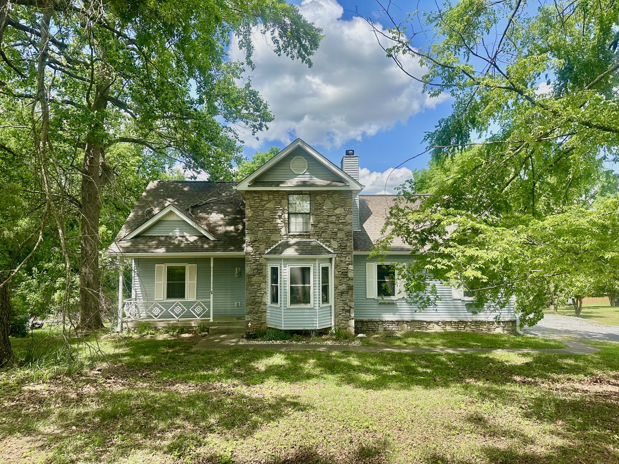141 South Palmers Chapel Road White House, TN 37188 - Photo 2 of 33 a front view of a house with a garden