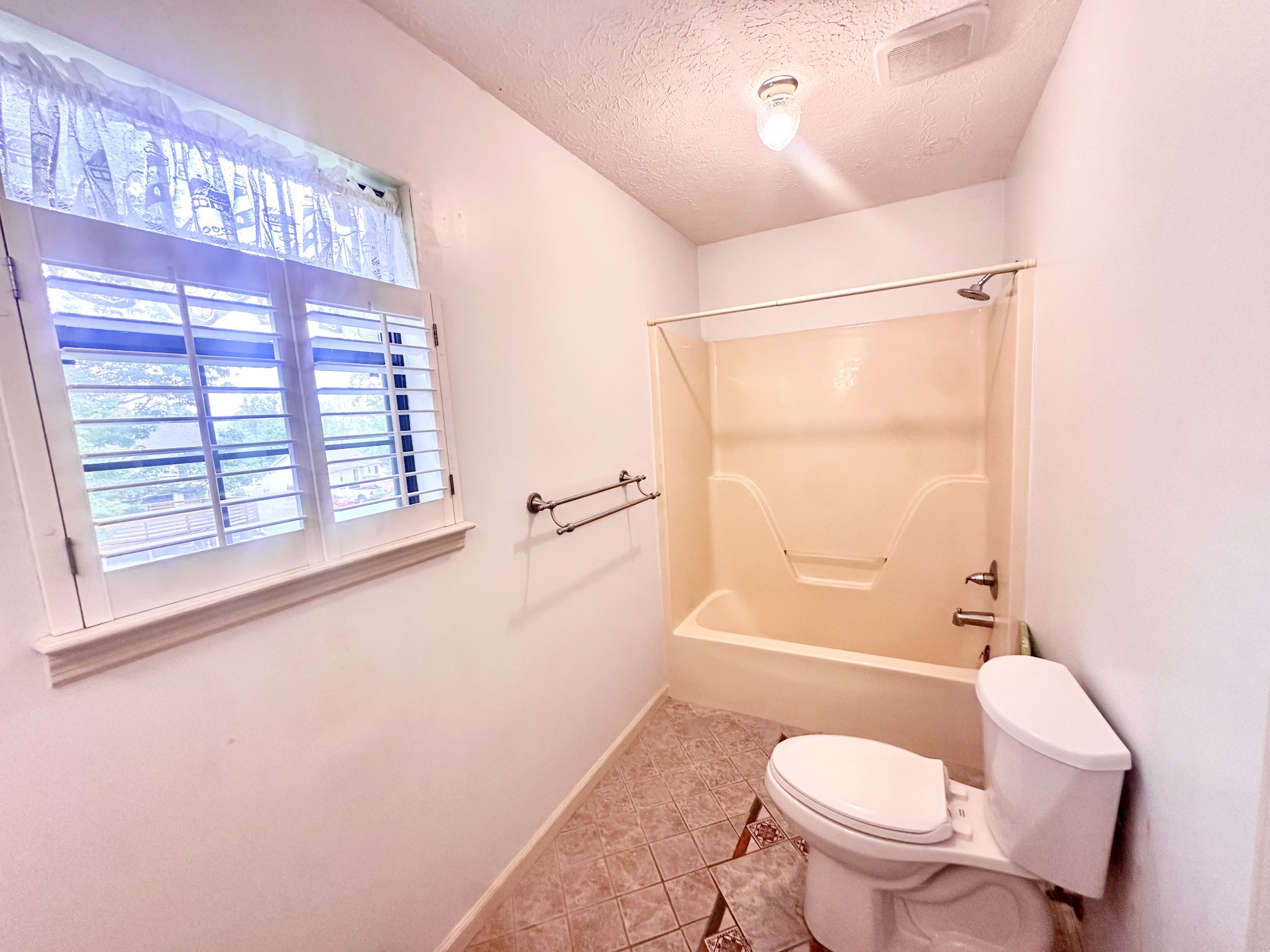 141 South Palmers Chapel Road White House, TN 37188 - Photo 25 of 33 a bathroom with a granite countertop toilet a sink and a shower