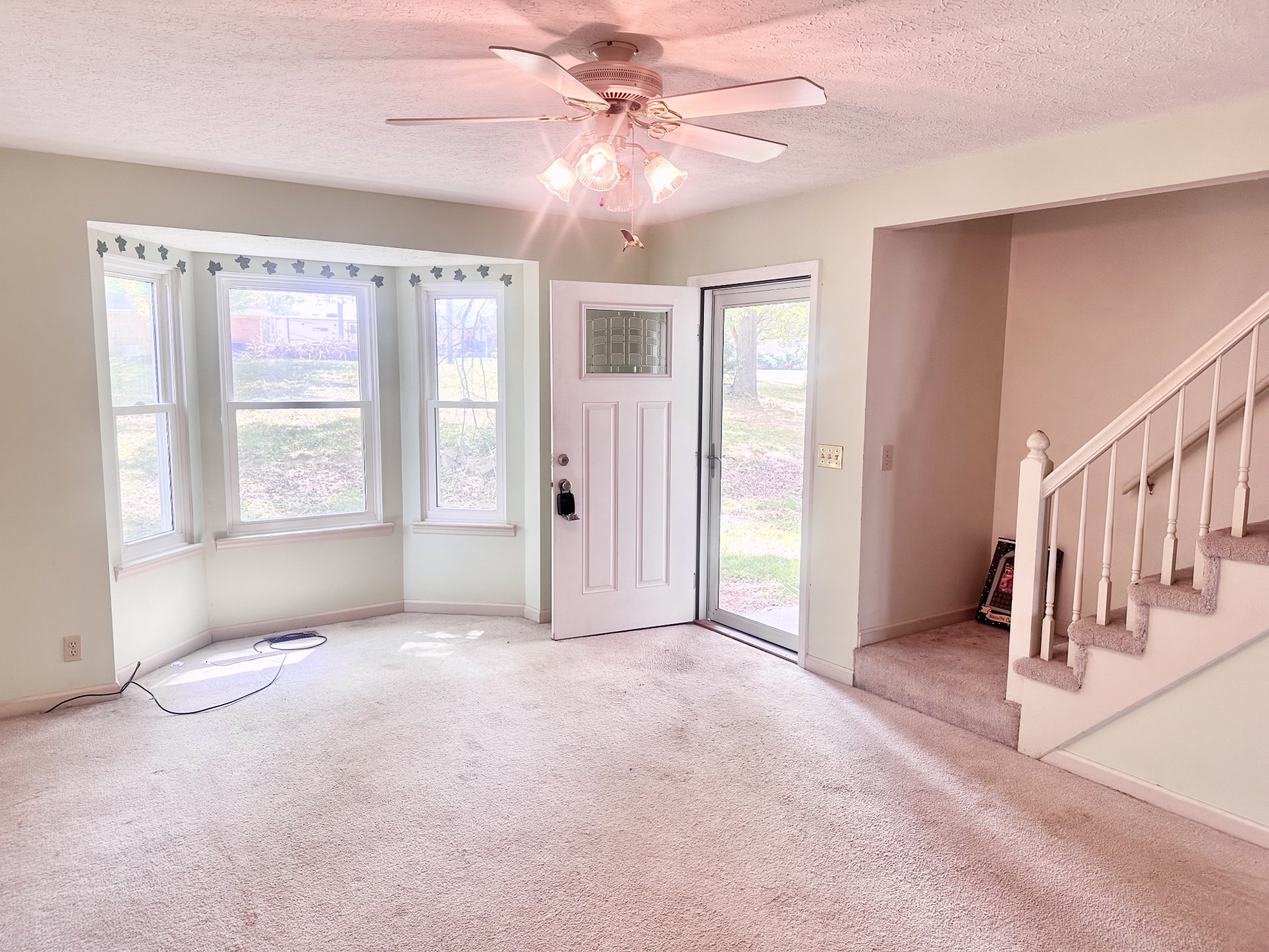 141 South Palmers Chapel Road White House, TN 37188 - Photo 6 of 33 a view of a livingroom with an entryway and a ceiling fan