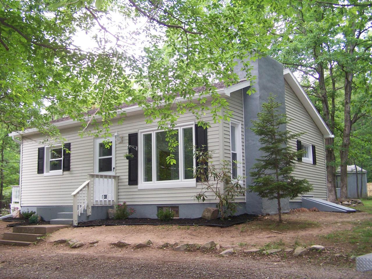 a view of a house with a yard