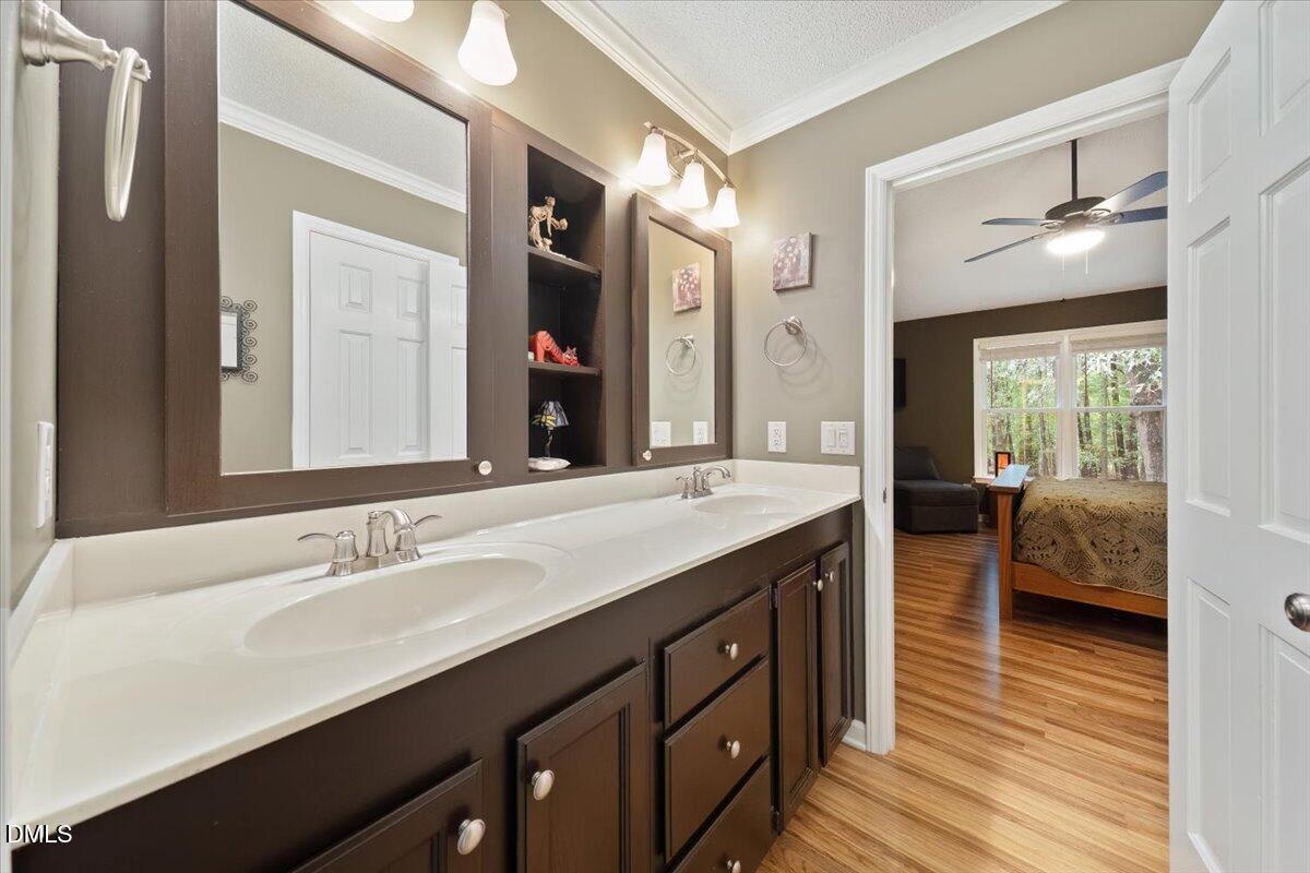 5216 Relay Way Raleigh, NC 27603 - Photo 17 of 27 a spacious bathroom with a double vanity sink and mirror