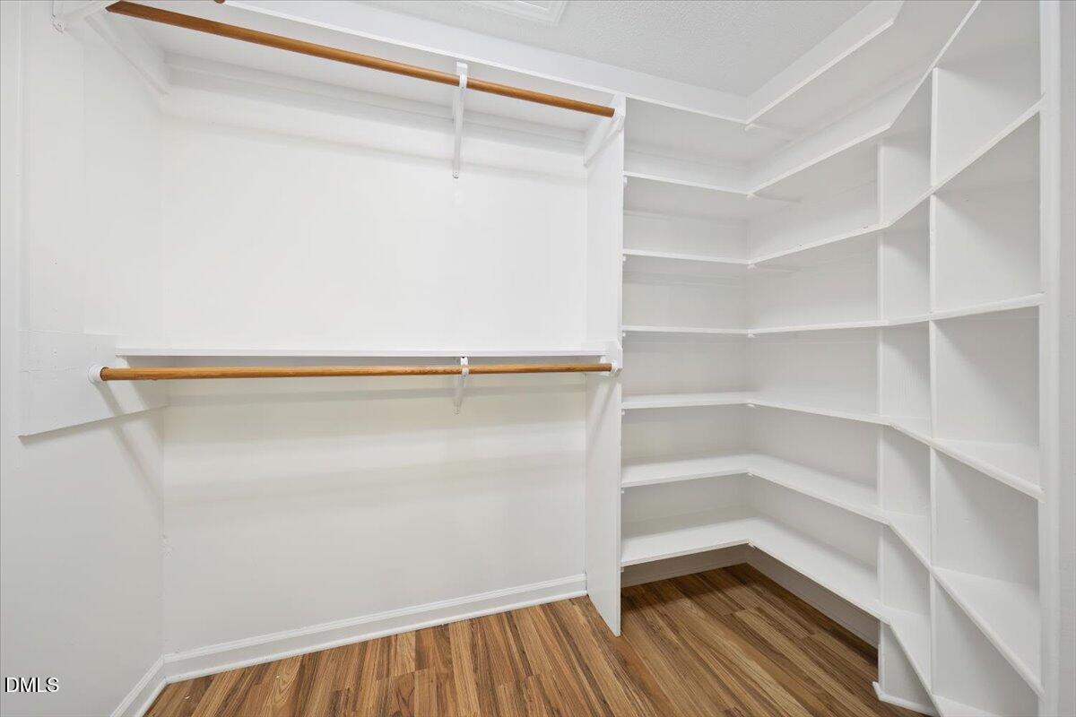 5216 Relay Way Raleigh, NC 27603 - Photo 18 of 27 a view of walk in closet with empty racks