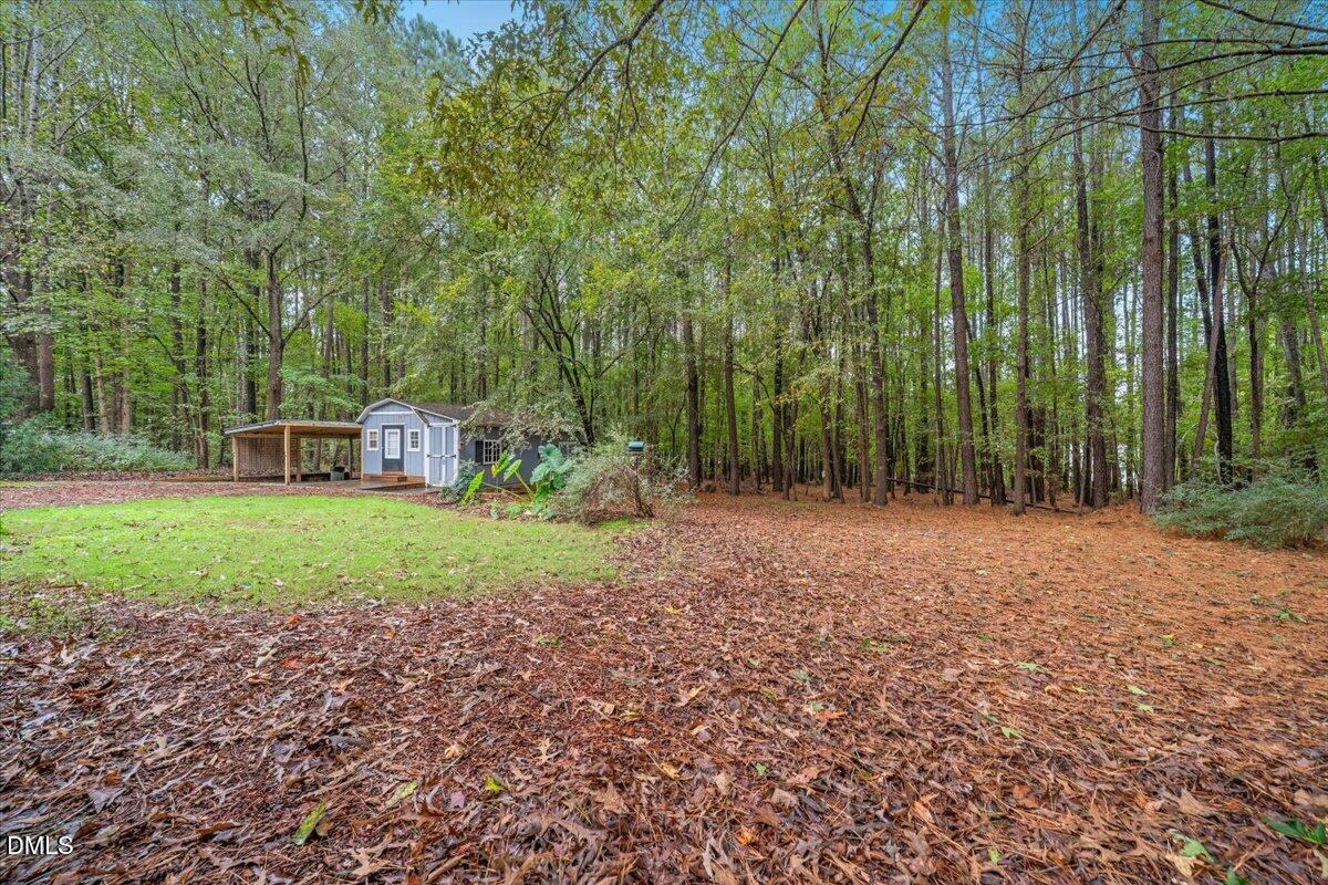 5216 Relay Way Raleigh, NC 27603 - Photo 25 of 27 a backyard of a house with lots of green space