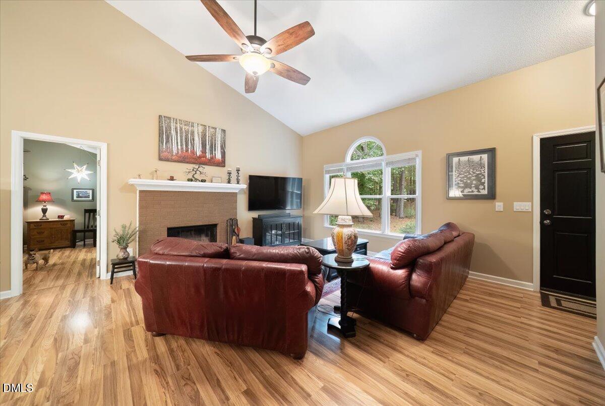 5216 Relay Way Raleigh, NC 27603 - Photo 6 of 27 a living room with furniture and a flat screen tv
