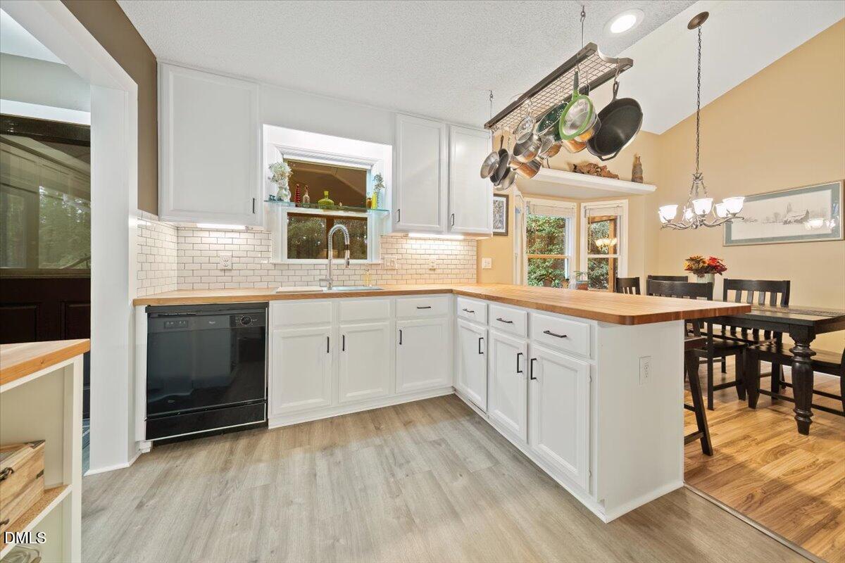 5216 Relay Way Raleigh, NC 27603 - Photo 9 of 27 a kitchen with a white cabinets and sink