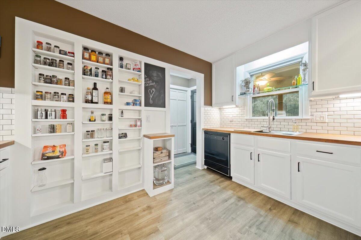 5216 Relay Way Raleigh, NC 27603 - Photo 10 of 27 a spacious bathroom with a double vanity sink and a mirror