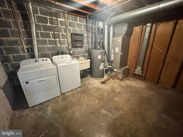 a view of storage and utility room with washer and dryer