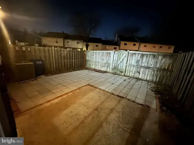 a bed sitting in a bedroom next to a small yard