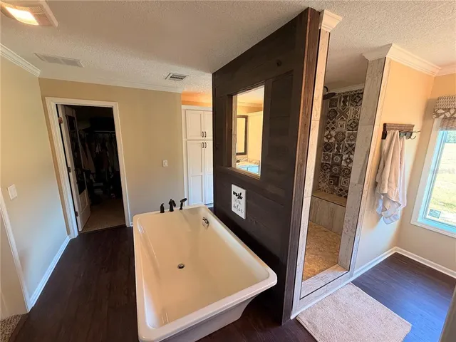 a view of a room with furniture and windows