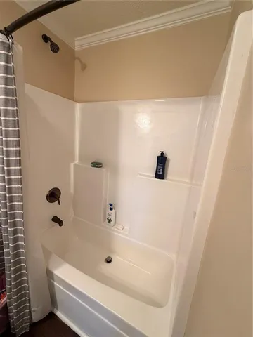 a living room with furniture window and wooden floor
