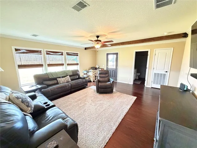 a view of a patio with wooden floor yard
