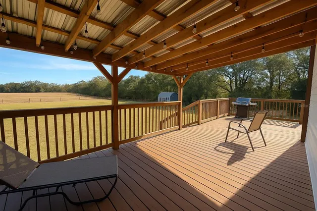 a view of a chairs and table in backyard