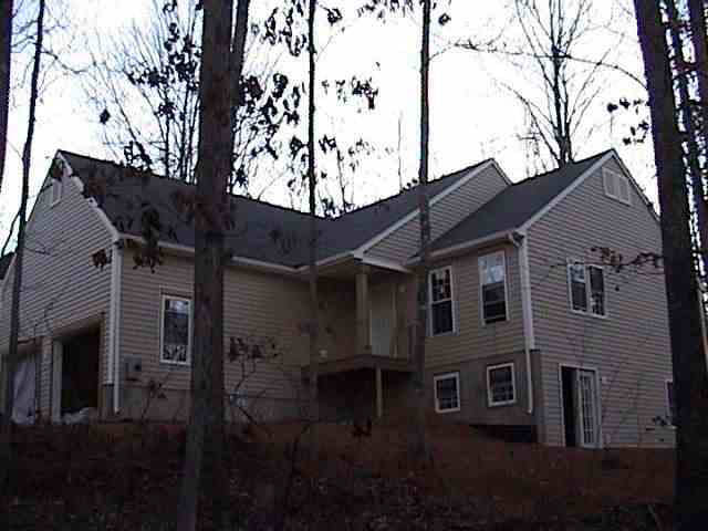 8 Colonial Road Lake Monticello, VA 22963 - Photo 1 of 1 a front view of a house with a garden