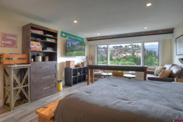 a very nice looking dining room with furniture and a large window